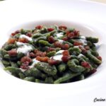 Risotto al nero di seppia con gamberi cotti e crudi