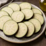 Melanzane a fette prima di friggere: il passaggio che blocca l’assorbimento d’olio
